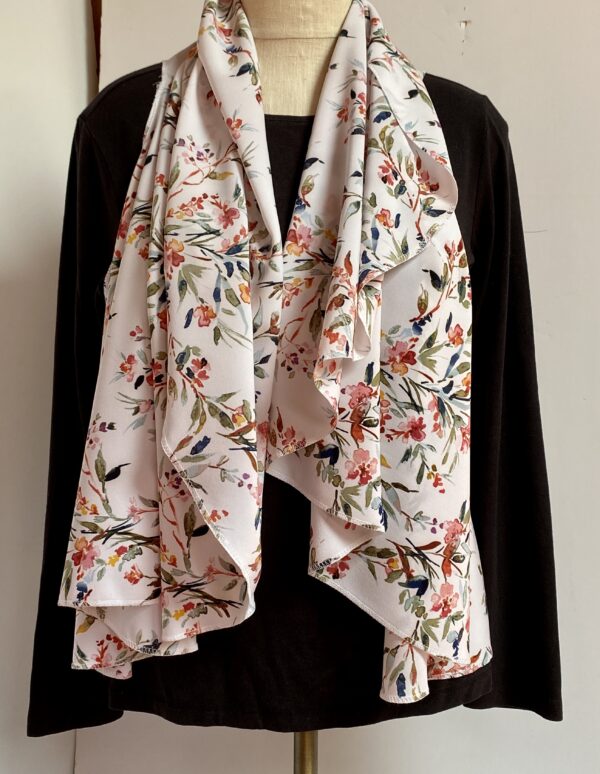 Floral patterns on white vest that's worn five different ways - Image 5