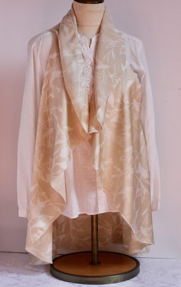 White on cream vest that can be worn five ways