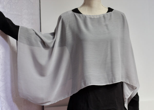 Light gray convertible poncho in a chiffon fabric