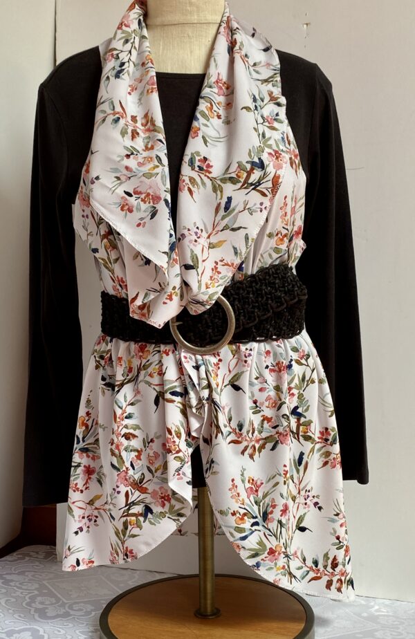 Floral patterns on white vest that's worn five different ways - Image 4
