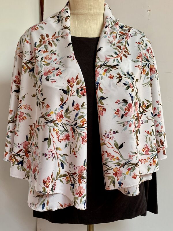 Floral patterns on white vest that's worn five different ways - Image 7