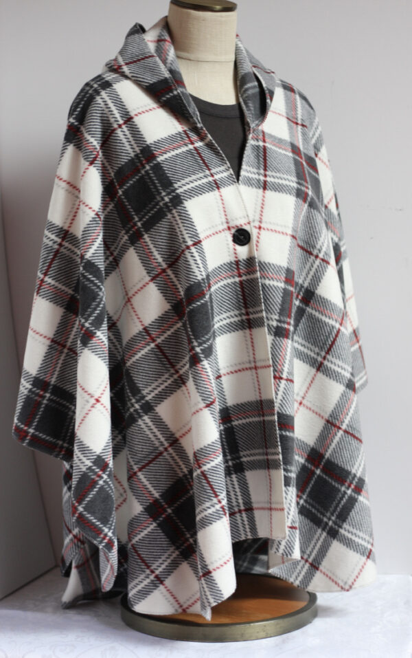 Black, gray, red plaid on white fleece poncho