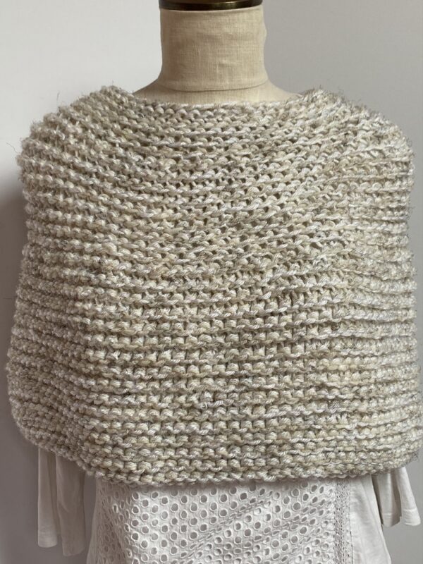 Hand knit coverlet in linen colors