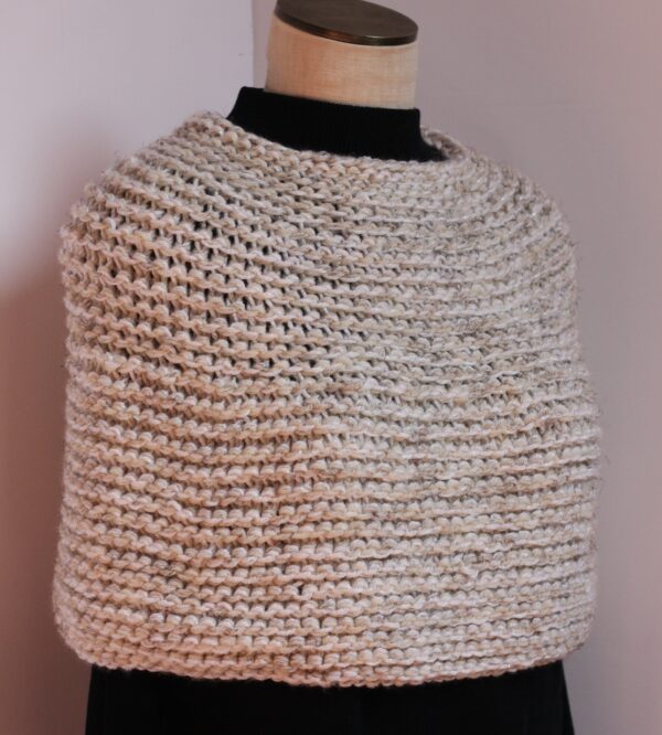 Hand knit coverlet in shades of cream and white sparkles
