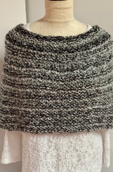 Hand knit coverlet in black, white and gray tweed